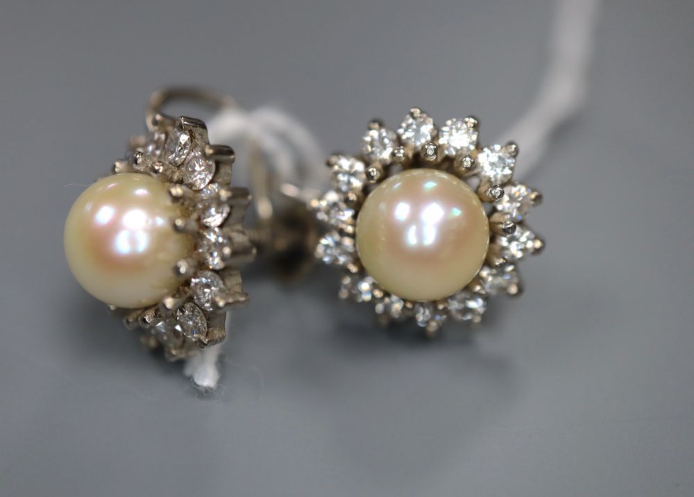 A pair of 18ct white gold, cultured pearl and diamond cluster earrings, post and butterfly fittings, 12mm, gross 6.2g.